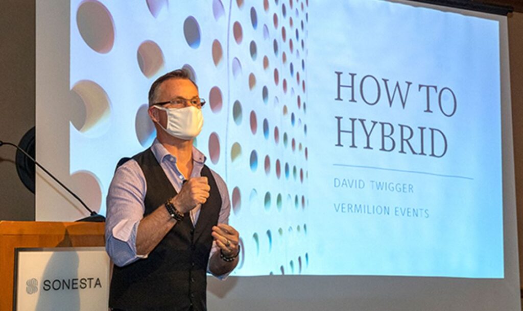 David Twigger, fully masked, running a how to hybrid event during the COVID pandemic