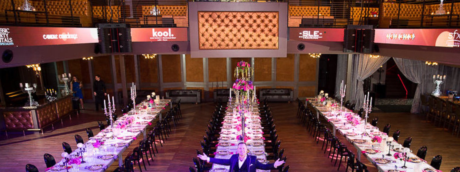 VE Home Page 4 David Twigger standing in front of long, elegant tables at one of his events