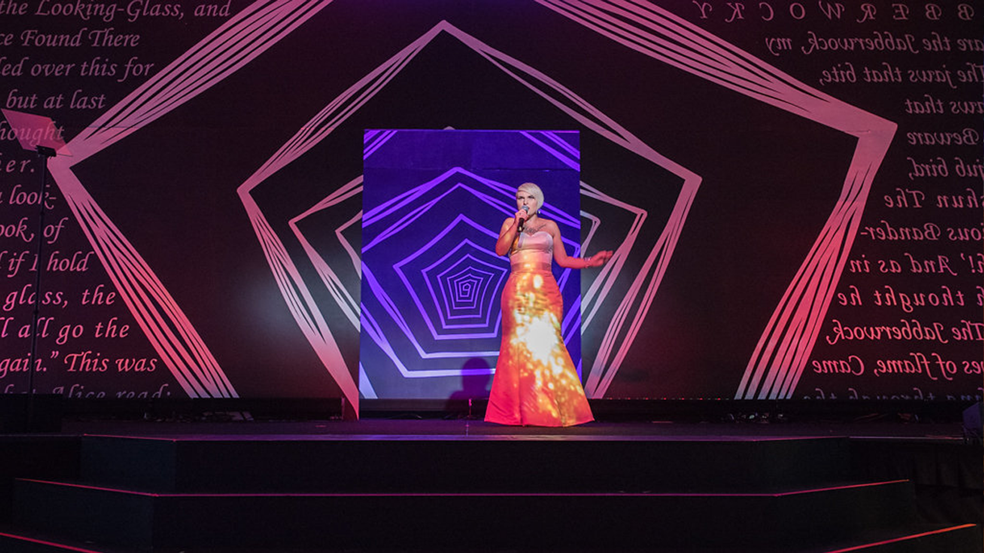 A woman in a fancy, glittery dress performing onstage