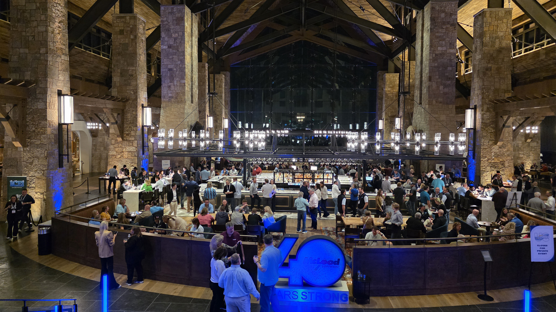 A large event inside of a giant rustic room